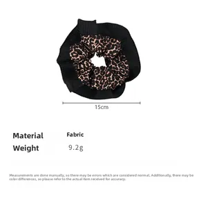 Detail view of 15cm leopard print and pleated black fabric scrunchie with dimensions