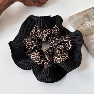 Vintage leopard print scrunchie with black pleated lace detail on white background