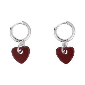 Minimalist silver hoop earrings with dark red heart pendants on a clean white background
