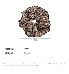 Detail of leopard print scrunchie showing 19cm diameter and 15.5g weight specifications