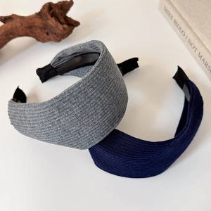 Detail of ribbed knit headbands in grey and navy blue with soft textured fabric