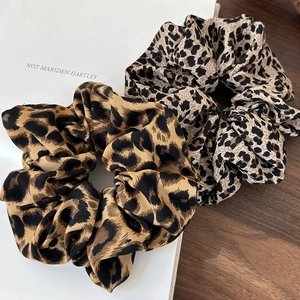 Elegant leopard print scrunchies set in warm brown and beige silk-like fabric