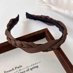 Detail of coffee brown braided satin headband with French vintage elegant texture