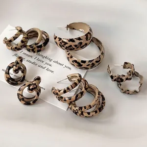Collection of retro leopard print hoop earrings and studs with unique aesthetic textures