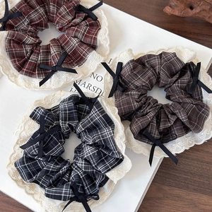 Three vintage plaid scrunchies with lace edges and bows in wine red, coffee, and grey
