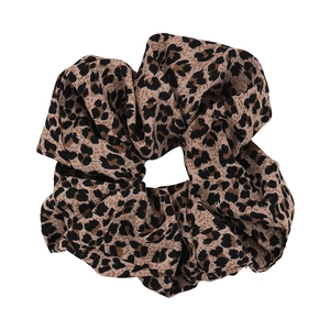 Classic leopard print oversized scrunchie hair tie made of soft fabric in brown and black