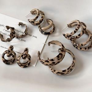 Detailed set of leopard print hoop earrings in multiple styles on a clean white background