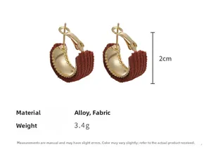 Detail view of retro red fabric wrapped C-shaped gold hoops with size dimensions