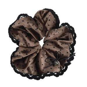 Brown velvet polka dot scrunchie with black lace trim and a bow detail for women