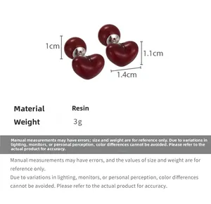 Detailed view of dark red resin heart stud earrings with sizes 1.1cm and 1.4cm