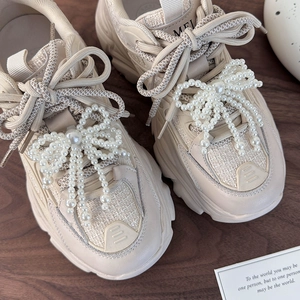 Chunky cream sneakers featuring elegant oversized pearl bow lace-up charms for women