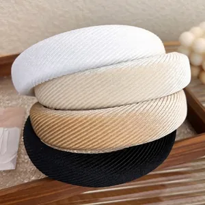 Set di quattro cerchietti imbottiti in tessuto twill nei colori bianco beige marrone nero
