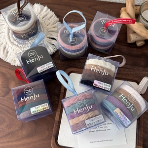 Set van vijf naadloze, zeer elastische haarelastiekjes in een transparante geschenkdoos