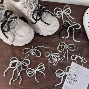 DIY beaded bow shoe charms in pearl white and obsidian black for sneakers decor