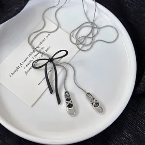 Elegant bow and ballet slipper pendant necklace with silver snake chain for women