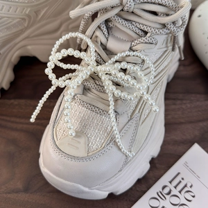 Beige chunky platform sneakers with elegant pearl bow shoe charms in Korean style