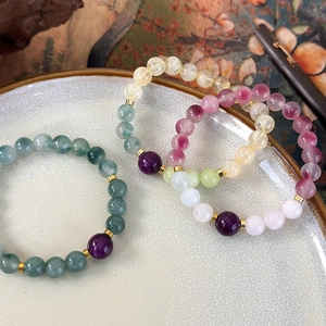 Ethnic style handmade beaded bracelet set with multi-colored stones and gold spacers