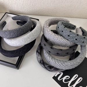Gray knitted headbands with polka dots and bow designs in various fabric textures