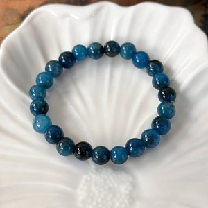 Detailed view of handmade single strand bracelet with blue natural apatite stone beads