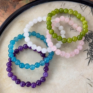 Set of five natural stone beaded bracelets in assorted vibrant colors with glossy finish