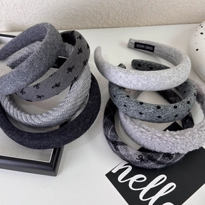 Detail of grey knitted polkadot headbands with textured fabric and vintage French style