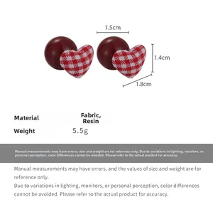 Detailed view of red and white plaid fabric heart earrings with size and weight specs