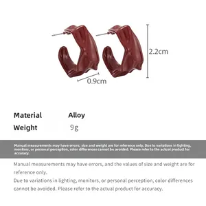Deep red irregular wavy hoop earrings with size dimensions and alloy material specs