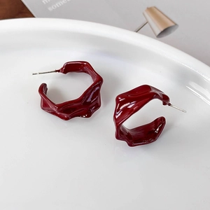 Elegant wine red irregular hoop earrings with wrinkled lava texture in glossy finish