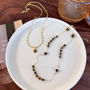 Double-layered tiger eye stone necklace set in gold finish with vintage pendant design