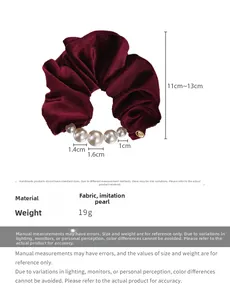 Detail showing high-elasticity burgundy velvet scrunchie with pearls and 11-13cm size mark
