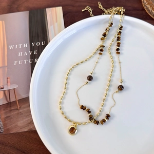Double-layered gold tiger eye stone necklace for women featuring beaded chains and a pendant