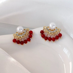 Detail of red bead tassel earrings with pearls and crystals in vintage court style