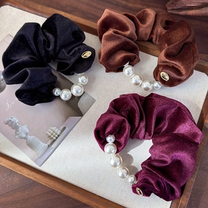 Three-piece set of velvet scrunchies with white pearls in black, brown and burgundy