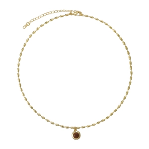 Elegant gold-tone layered tiger eye stone necklace with a round pendant on white background