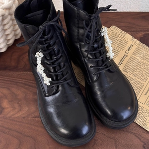 Classic black leather lace-up combat boots with elegant pearl floral charms decoration