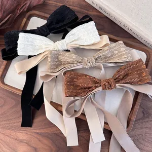 Elegant vintage bow hair clips with long lace ribbons in black white beige and brown tones