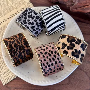 Retro animal print wide cuff bracelets in leopard and zebra patterns with velvet texture