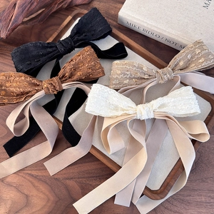 Elegant vintage bow hair clips with long satin ribbons in black brown and cream colors