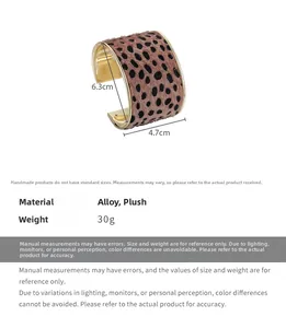 Detail view of leopard print plush bangle with 4.7cm width and 6.3cm inner diameter