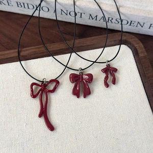 Elegant red bow pendant necklace with black wax rope cord, set of three distinct designs
