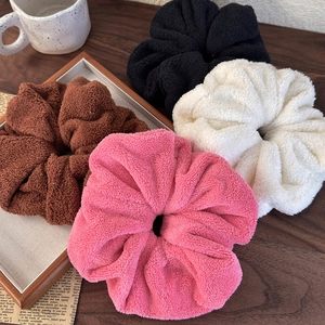 Set of four fluffy faux fur scrunchies in pink brown cream and black for women
