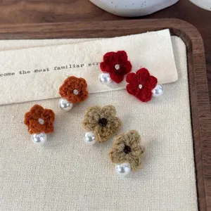 Handmade knitted flower earrings with pearls in red, orange and khaki colors