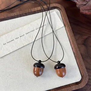 Vintage ebony wood acorn pendant necklace with a unique openable pinecone design