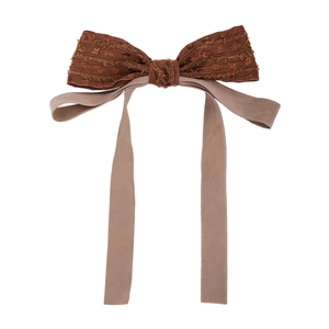 Elegant Hepburn style bow hair clip with vintage long ribbons in brown textured fabric