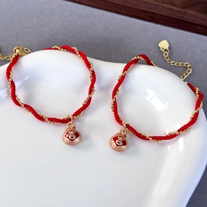 Handmade red braided cord bracelets with gold Fu bag charms and adjustable heart chains