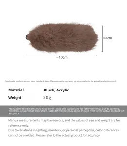 Detail view of coffee plush hair clip with dimensions 10cm by 4cm and soft texture