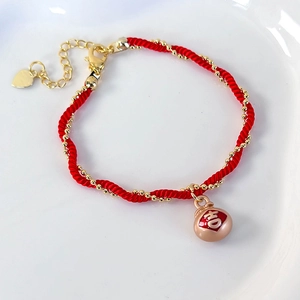 Handmade woven red string bracelet with lucky character charm and golden beads