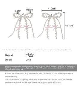 Detailed size specifications for pearl bow shoe charms with pink ribbons and metal hooks