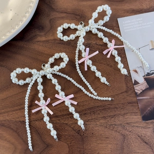 Elegant pearl bow shoe charms with pink ribbons and tassels for ballet style shoes