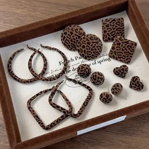 Retro geometric leopard print flocked earring set with matte finish on jewelry tray